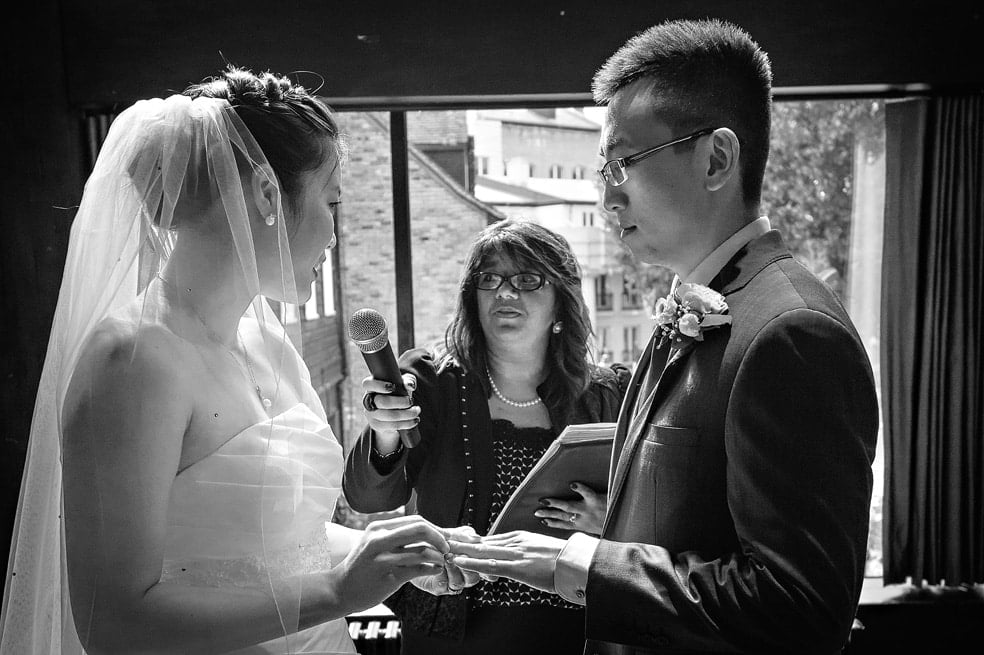 Registar Holding Microphone for Bride at Dickens Inn Wedding in London